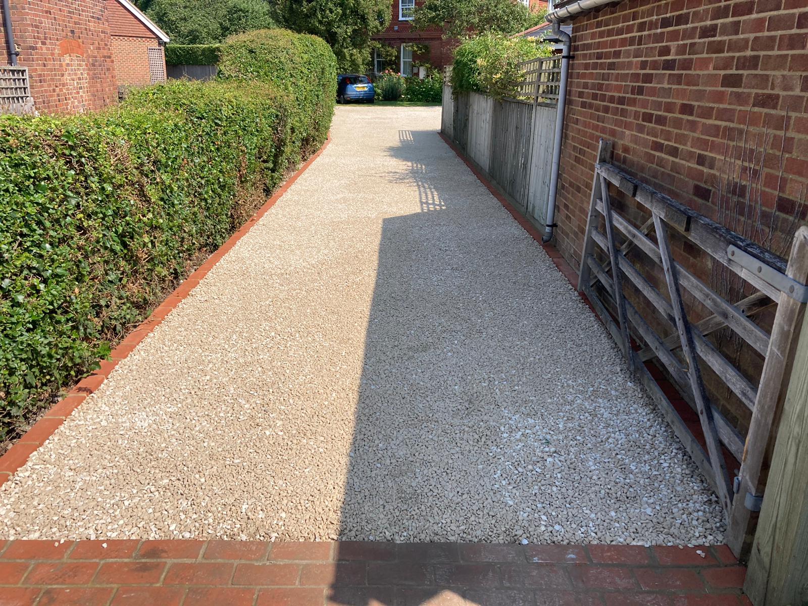 Cotswold stone driveway with red brick edging done in bethersden